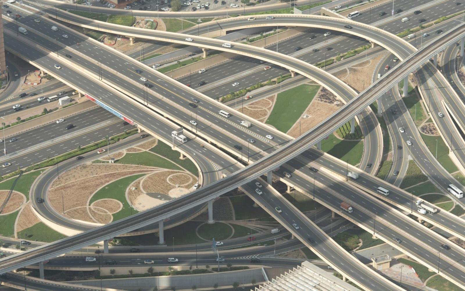 Aerial view of a Dubai highway interchange used by daily car lift routes